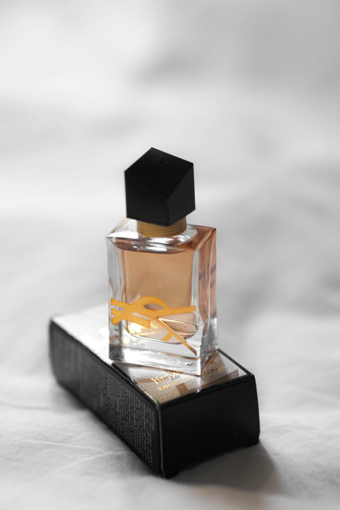 Elegant perfume bottle with black cap on a stylish box in Paris.